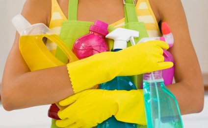 Woman with cleaning supplies